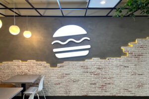 Burger Restaurant Design using 'Rustic Brick Red Old' Faux Wall Panels and LED Lighting