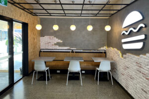 Burger Restaurant Design using 'Rustic Brick Red Old' Faux Wall Panels and LED Lighting